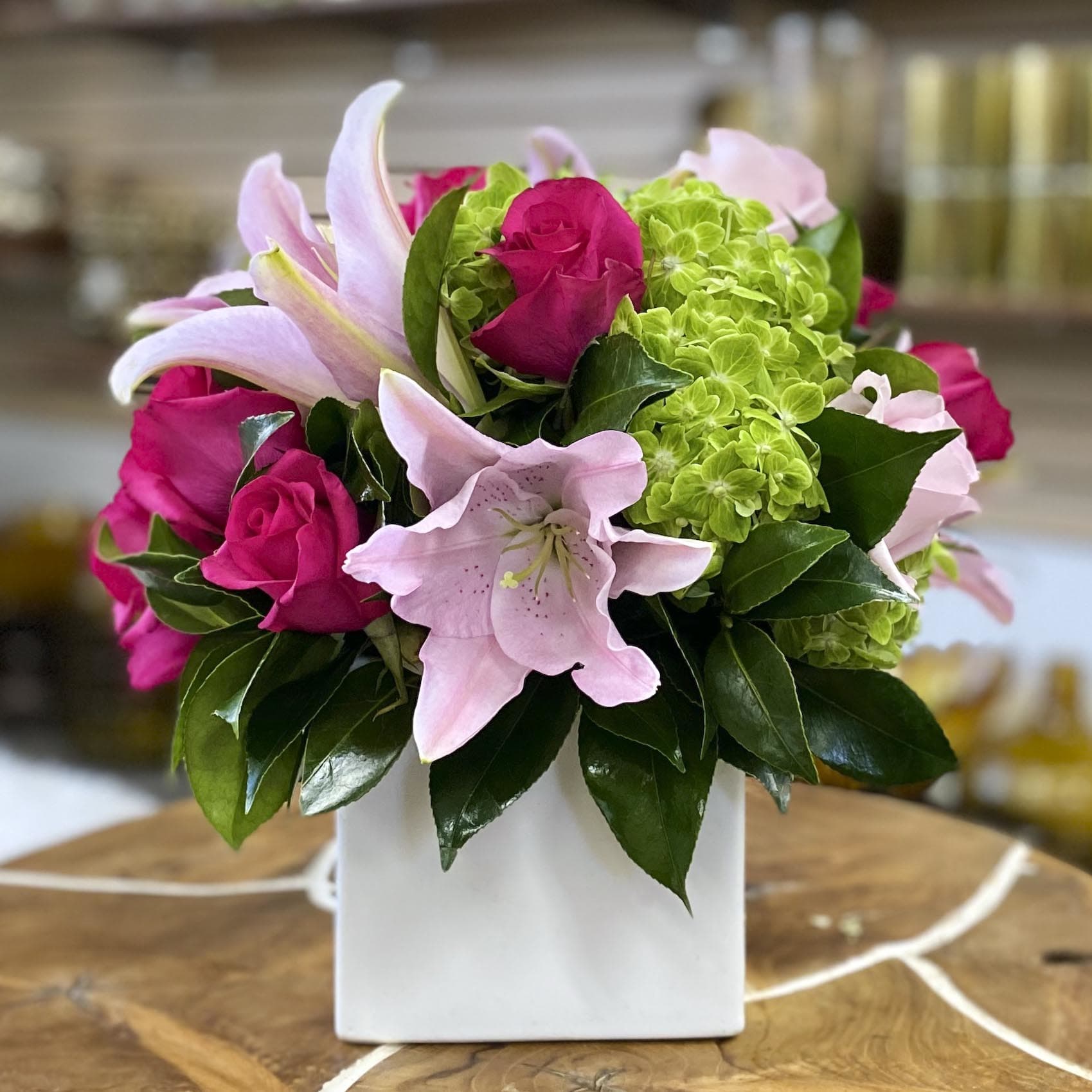 BRIGHT &amp; LIVELY - This colorful, spring bouquet contains lilies, spray roses, and hydrangea. It is the perfect gift to celebrate a birthday or new beginnings!! CSQ5505WT