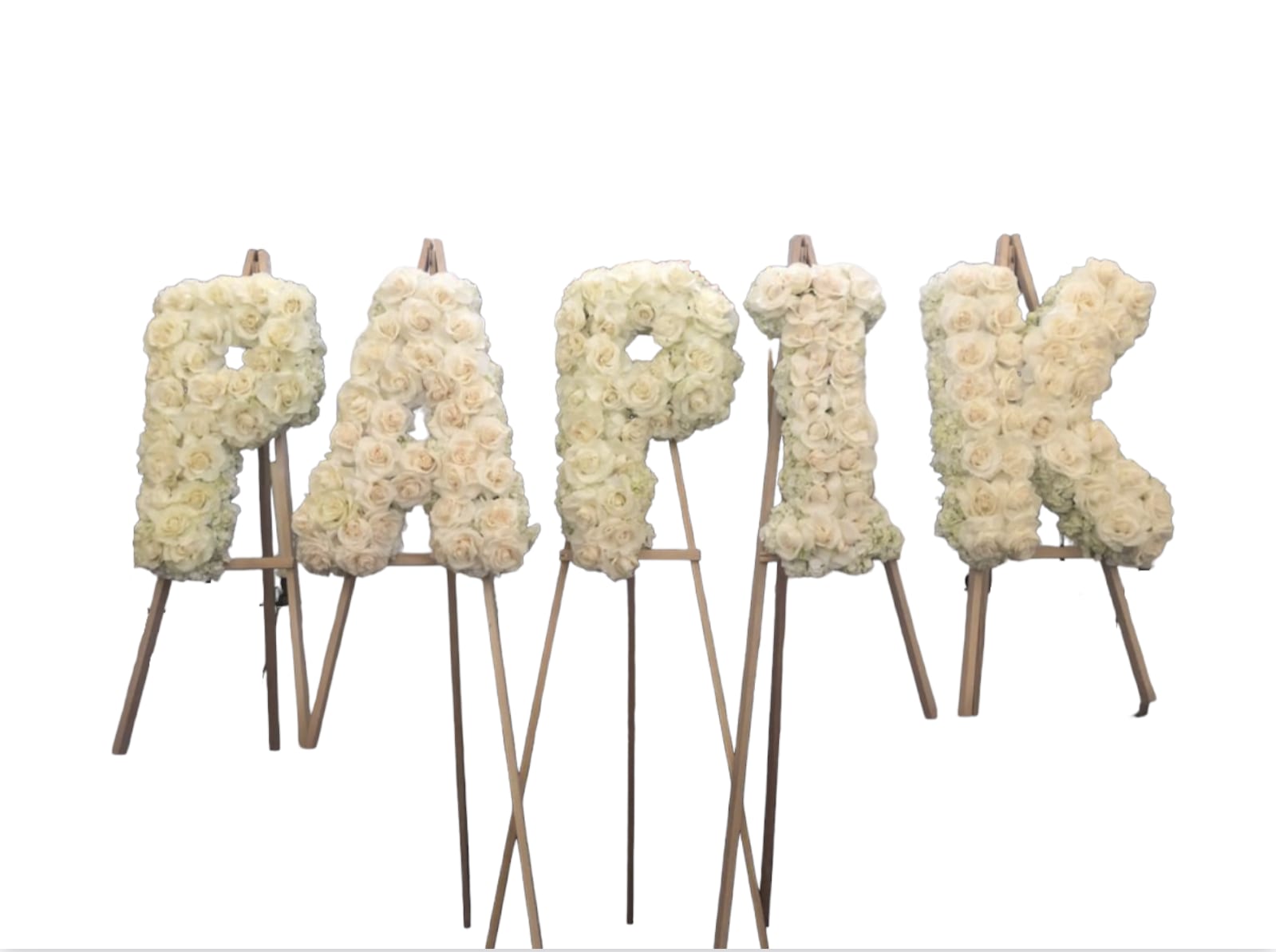 5 letter Arrangement 5 letter Arrangement - This funeral arrangement is a 5 letter piece. Could spell anything with 5 letter only. Filled with roses and hydrangea.