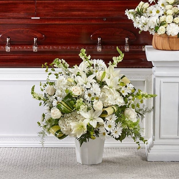Thoughts of Tranquility Floor Basket - Comfort, beauty and grace come together in this stunning display of serene blooms. Our Thoughts of Tranquility Floor Basket is handcrafted by a local florist with ivory roses and white hydrangea, snapdragons and lilies to show how much you care. The Standard Bouquet is approximately 30&quot;H x 27&quot;W. The Deluxe Bouquet is approximately 32&quot;H x 32&quot;W.
