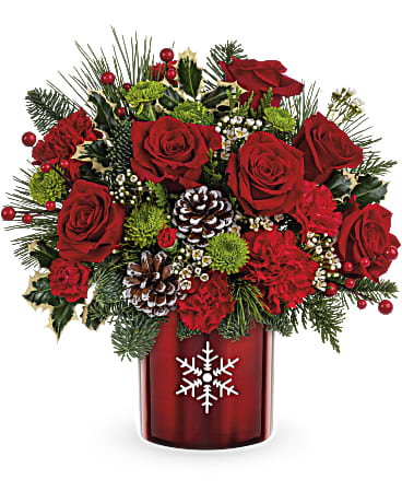 Stunning snowflake premiere  - Make their holidays merry and bright with this classic Christmas carnations bouquet in a shimmering metal vase with charming snowflake cutout. Later, it's lovely as a votive! These holiday flowers are sure to deck your halls right! This Christmas flower arrangement includes red carnations, miniature red carnations, green button spray chrysanthemums, white waxflower, cedar, noble fir, white pine 