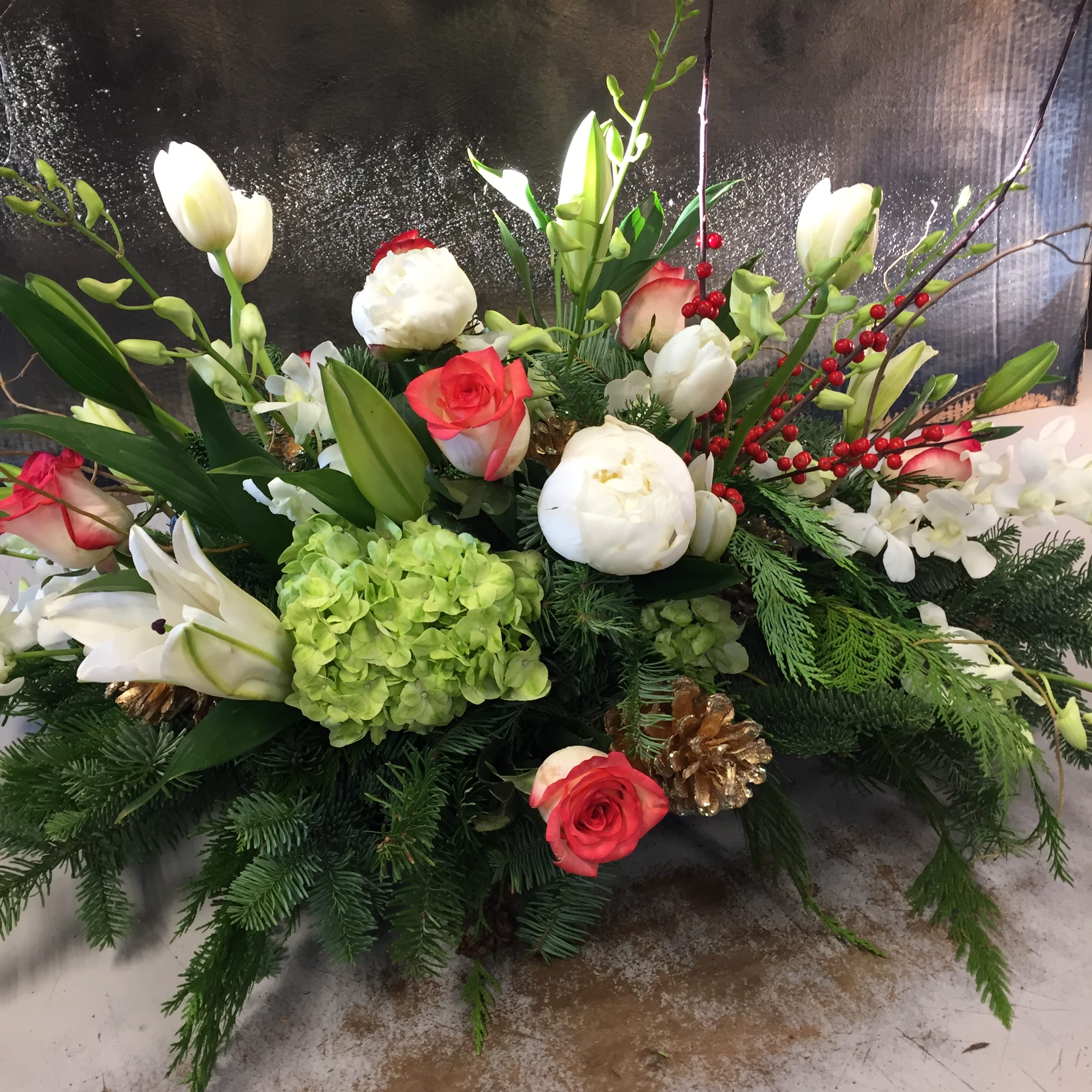 Ultra Holiday Centerpiece - A designer choice, very large centerpiece, for when you really want to make a statement! Some substitutions may apply. The designer will choose from what is looking absolutely best at the flowers market.