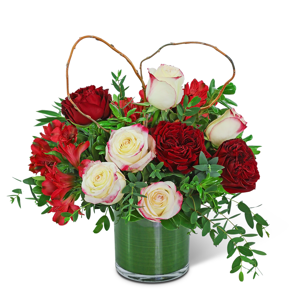 Romance in the Air - This gorgeous design is hand-arranged by our professional floral designers and delivered in a lovely leaf-lined vase. The rich, romantic colors of Romance in the Air are sure to melt the heart of your loved one. Beautiful ruffly roses, alstroemeria, and premium foliage are artfully arranged with a natural heart accent nestled in. Flower delivery has never been easier or more appreciated. Whether you are looking for a birthday, anniversary, or valentines day gift, we have flowers that are sure to fit the occasion!