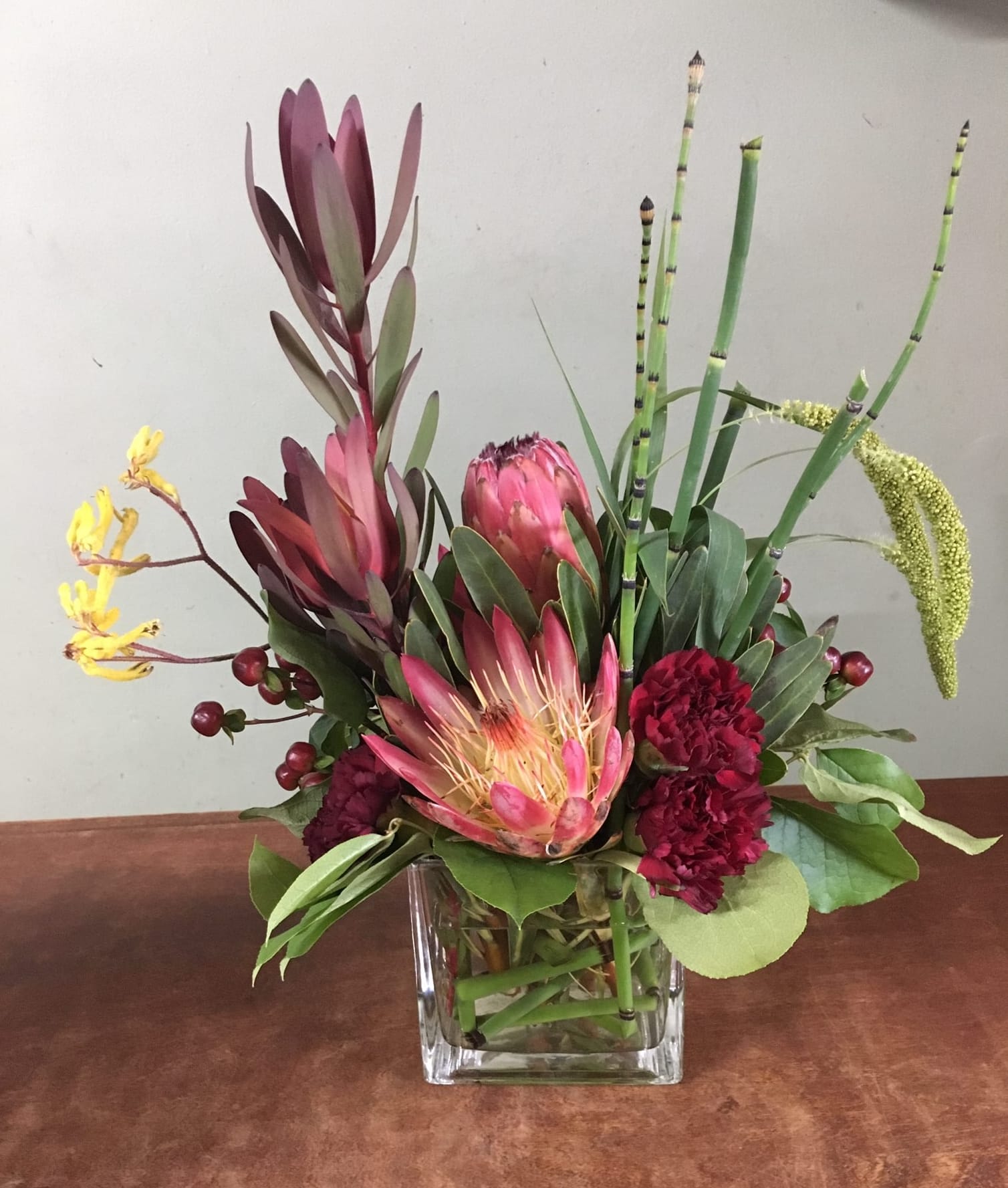 Safari Love - Unique array with proteas, safari arrange in a glass vase. 