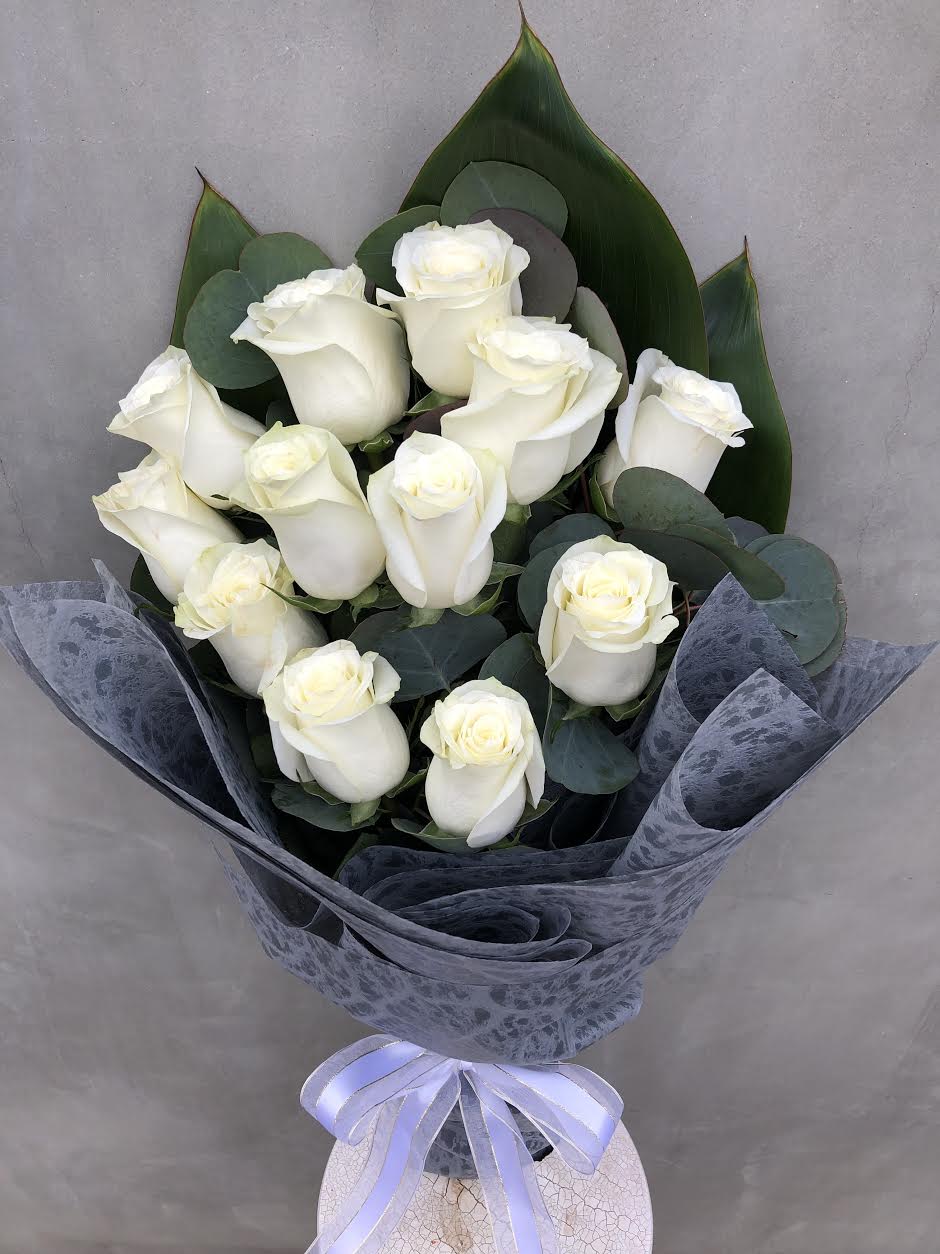 Purify Love Purify Love - ONE DZ. WHITE ROSES WRAPT IN SPECIAL TISSUE PAPER.
