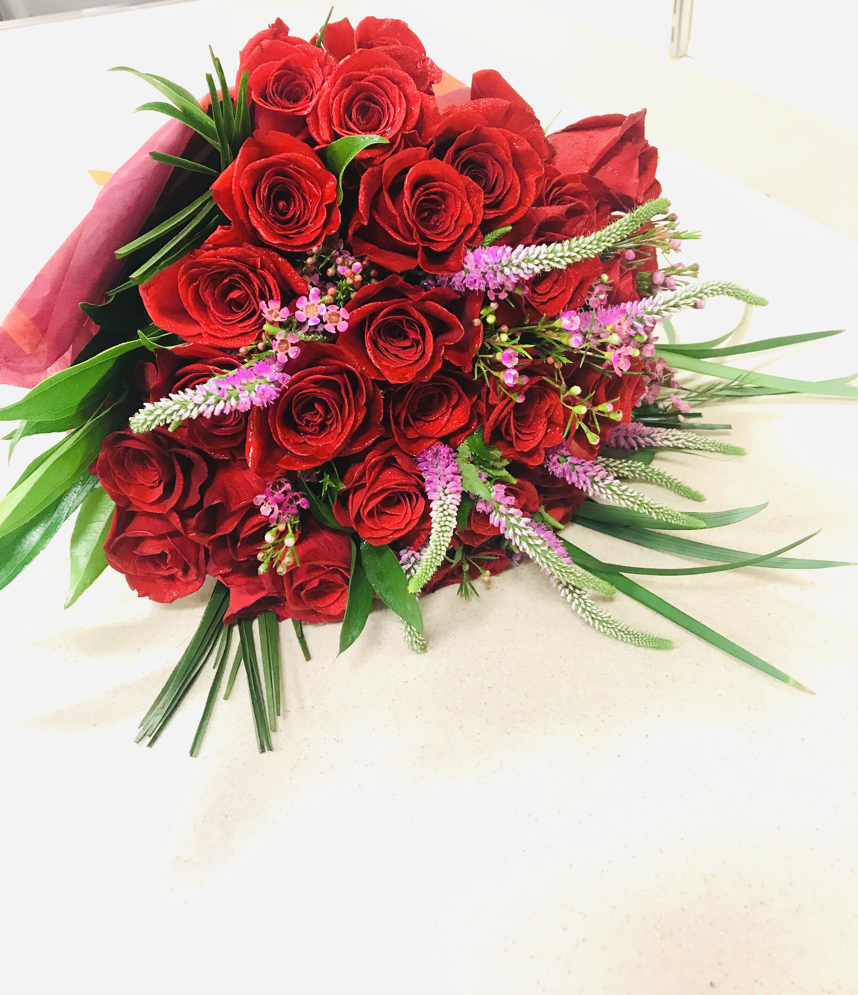 Hand-Tied Rose Wrap with 3 dozen roses - Beautifully wrapped bouquet of roses in your color choice with fillers.