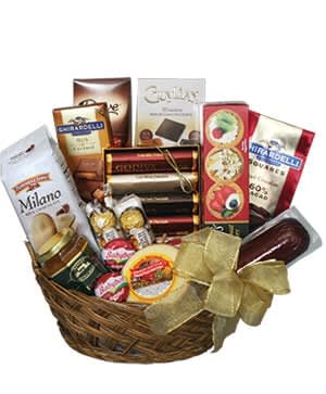 Gourmet Basktet - (Please remember that each selection is custom made and substitutions may be necessary. Your order will be produced as closely as possible to the picture.)  Includes: Round Basket, Gourmet Snack Food Items &amp; Premium Chocolates, (Items Shown: Asst Cheeses, Sausage, Crackers, Pepperidge Farm Cookies, Guylean, Dove, Ghiradelli, Godiva &amp; Rocher Chocolates, Etc)