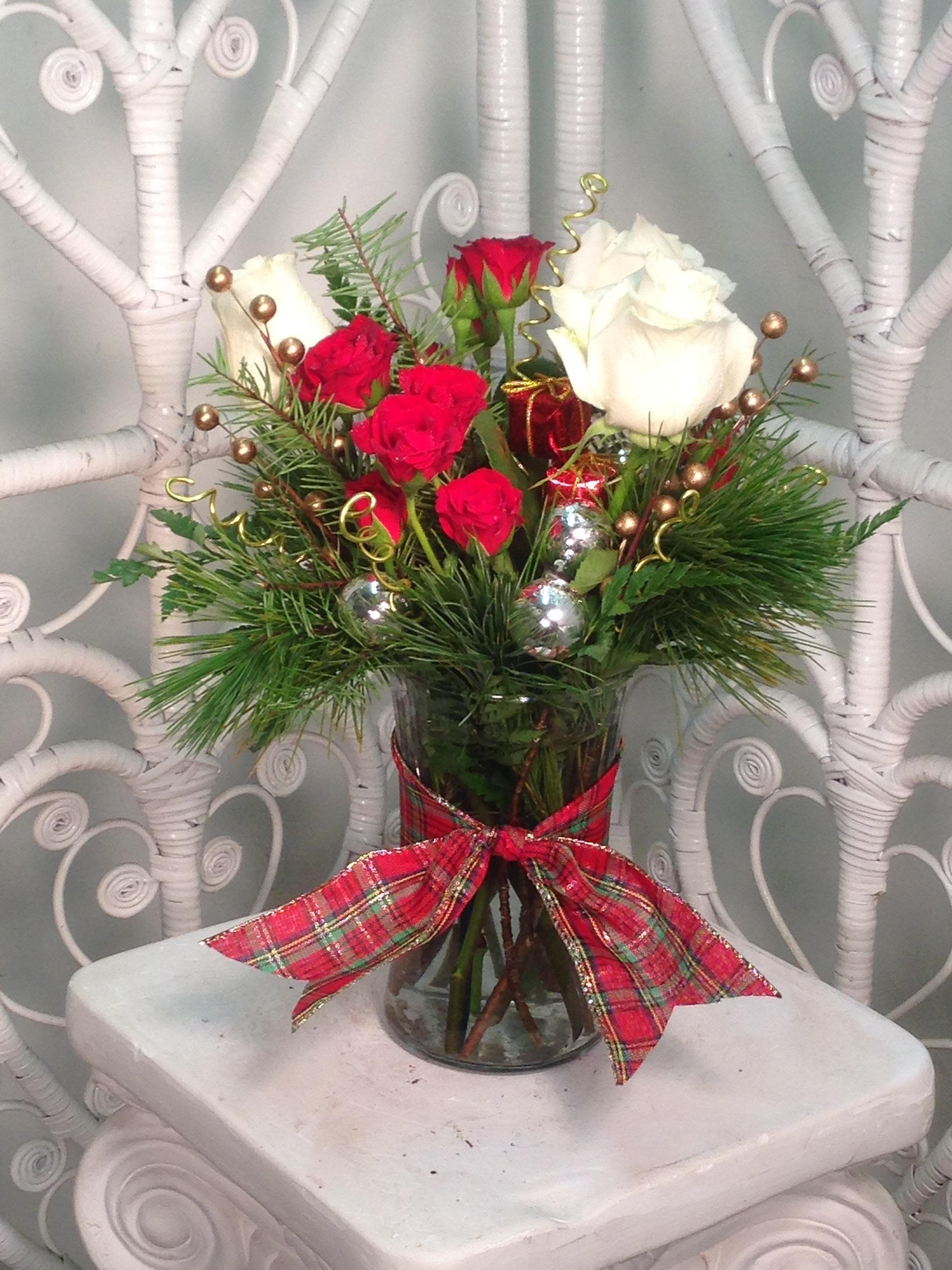 Holiday Cheer with Roses Holiday Cheer with Roses - White roses and red spray roses arranged with fresh evergreens and Holiday ornaments and accents to bring the cheer!