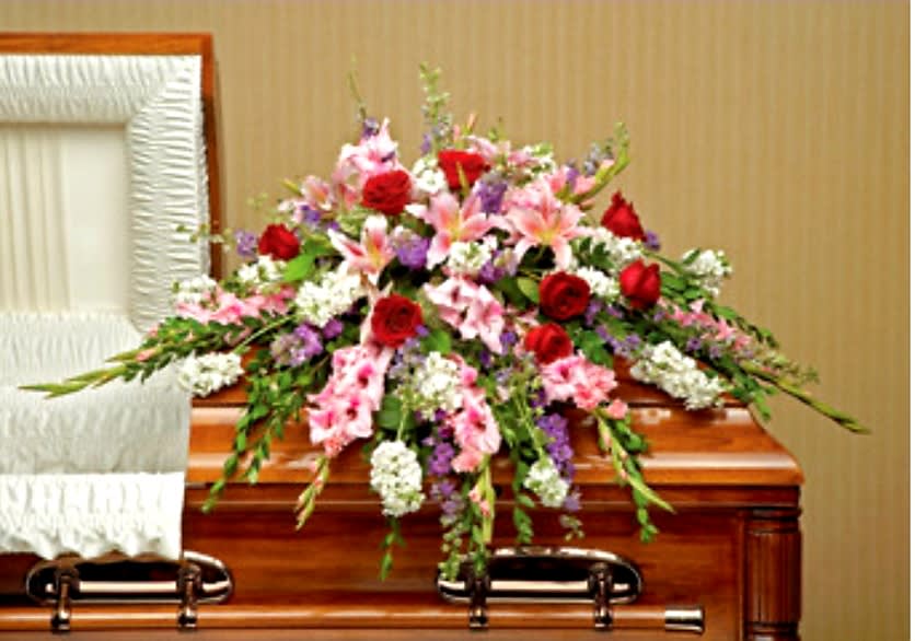 Perfect Pastoral Casket Spray - Express your sympathy with a lush and pastoral casket spray of gladioli, Asiatic lilies and blooms in gentle shades of pink, white and lavender, accented with red roses for love.