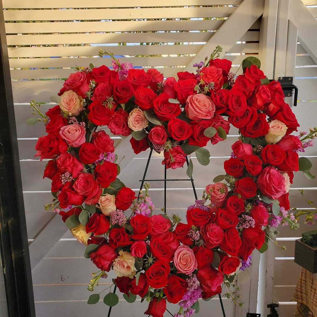 Heartfelt sympathy floral in red and pink roses by Barrio Logan florist  - Eternal love in heartfelt floral arrangement in red roses and or pink mix or complete reds.  