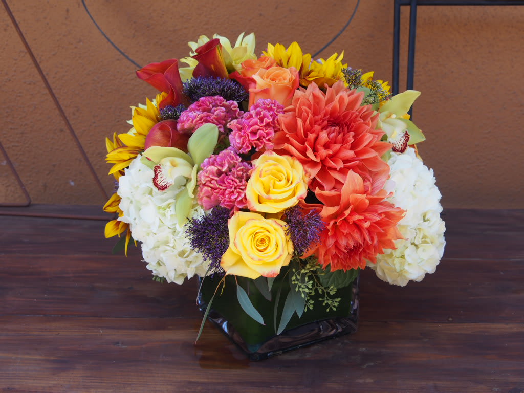Liveliness Liveliness - 6" Square vase with colorful arrangement of mixed color roses, dahlias, hydrangeas and more.