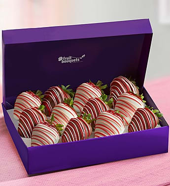 Sweet Desire - Product ID: 106033  Bring a little romance to your night with our luscious dipped strawberries. Drizzled in romantic pink and red chocolaty confections, theyâre the sweetest way to spice things up. 12 delicious dipped strawberries, 6 dipped in milk chocolaty confections with pink and red drizzle and 6 dipped in white chocolaty confections with pink and red drizzle Fruit is picked at the peak of freshness Hand-crafted and designed by local florists Arrives in a in a purple Fruit Bouquets branded box Delivered fresh to their door with Same-Day Delivery Allergy Warning: Fruit Bouquets products may contain peanuts and/or tree nuts. We recommend that you take the necessary precautions based on any related allergies.