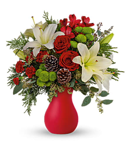 Teleflora's Yuletide Greetings Bouquet Teleflora's Yuletide Greetings Bouquet - If you're going to a holiday party, thank your hostess or host ahead of time by sending this enchanting bouquet in a timeless matte red vase. You'll be assured of a warm welcome! Red roses and carnations, green button chrysanthemums and white lilies pop against a background of lush winter greens. Orientation: All-Around