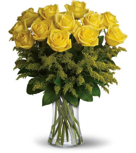 Rosy Glow Bouquet - T70-1A - Yellow roses symbolize friendship and sending this sunny bouquet of bright yellow flowers is such a beautiful way to celebrate a special bond. Destined to make anyone's day glow these roses are brilliant! Glowing yellow roses and solidago mixed with greens are delivered in a clear glass gathering vase. Sunny skies ahead!Approximately 16&quot; W x 20&quot; H Orientation: All-Around As Shown : T70-1ADeluxe : T70-1BPremium : T70-1C
