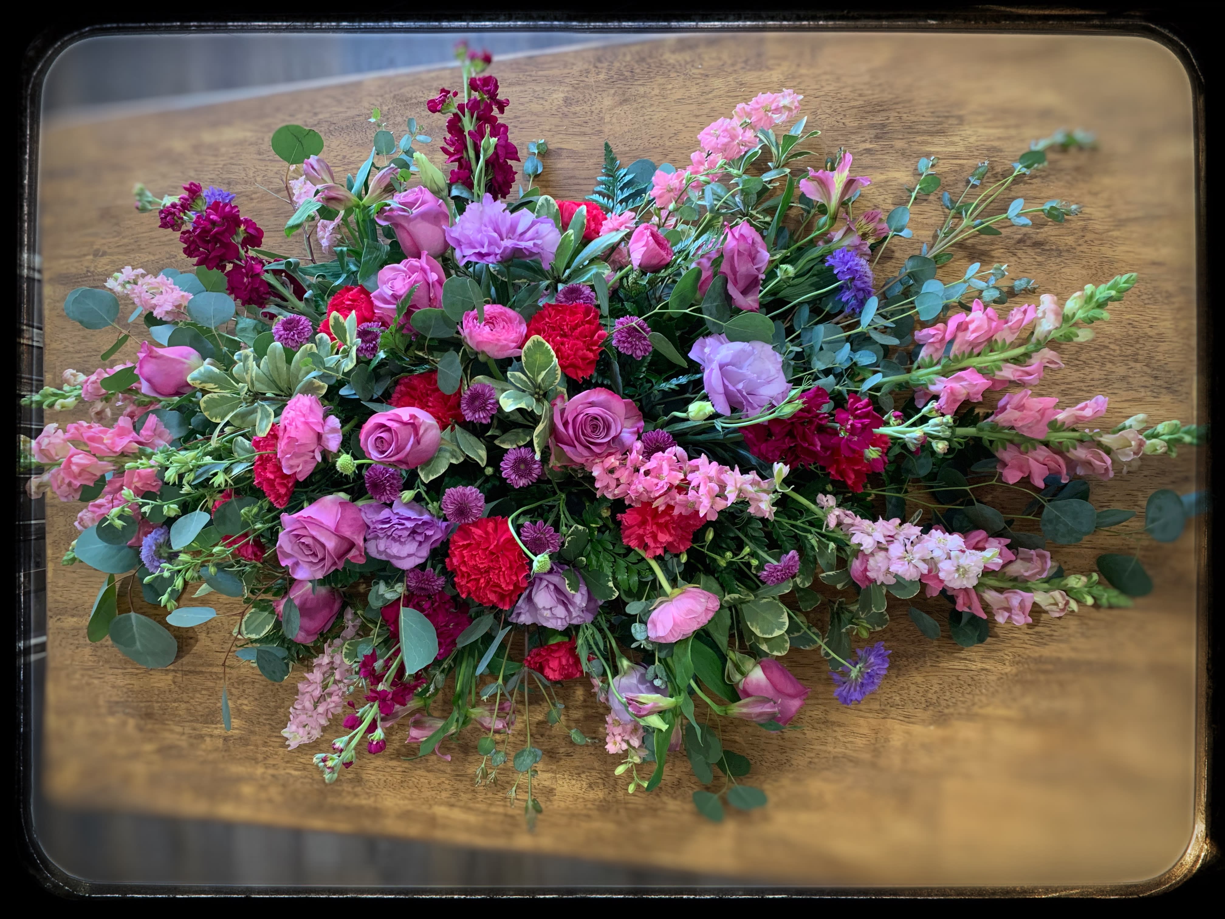 Love Always Casket Spray Love Always Casket Spray - A beautiful mix of pink and purple blooms make up this casket spray and says we will always love you.