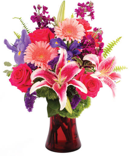 Flirty Fondness - A bright mix of bold colored stargazers, gerbera daisies, irises, roses, and stock