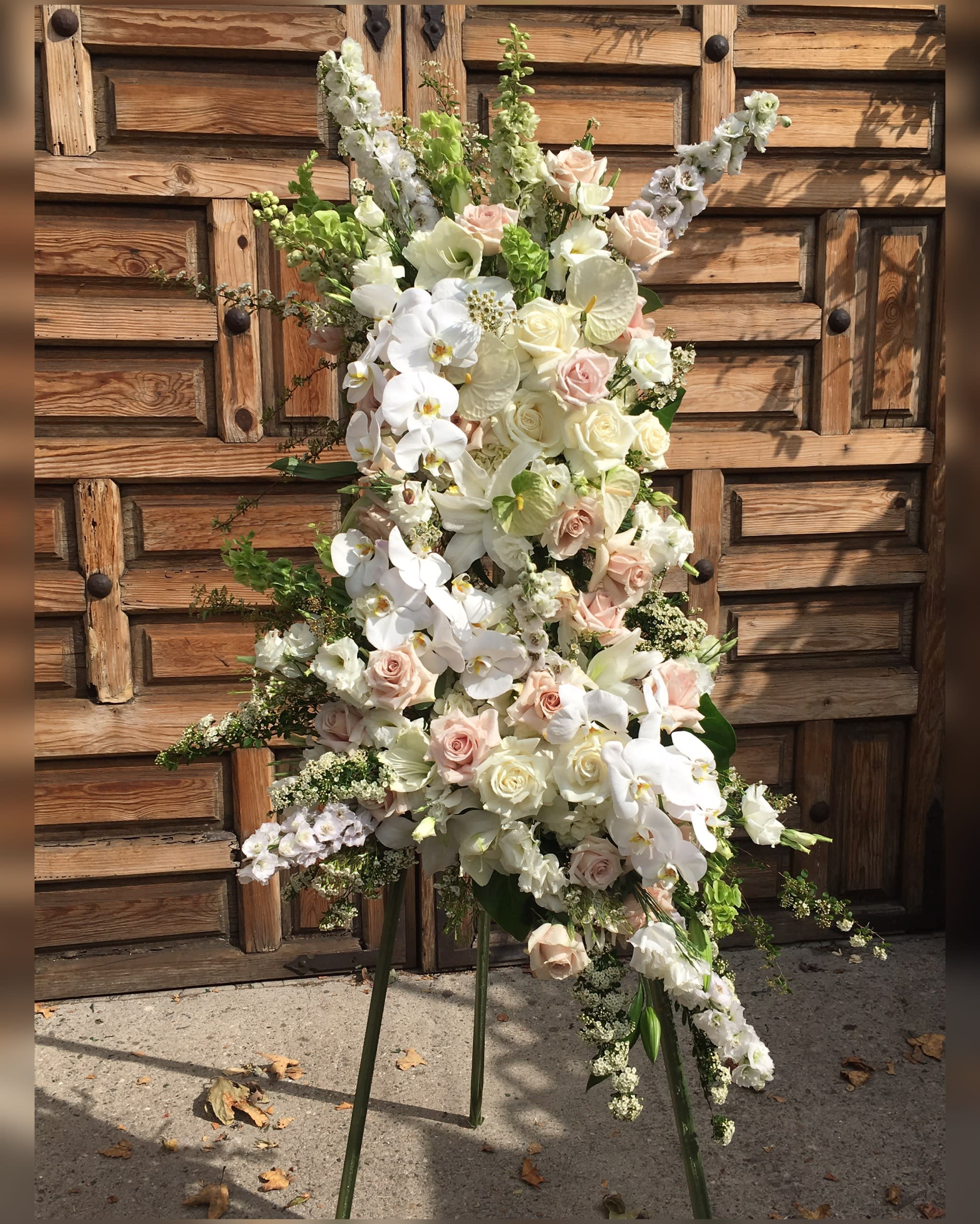 Gentle Solace  - Big beautiful funeral spray in soft pinks, creams and white that will definitely make an elegant statement. 