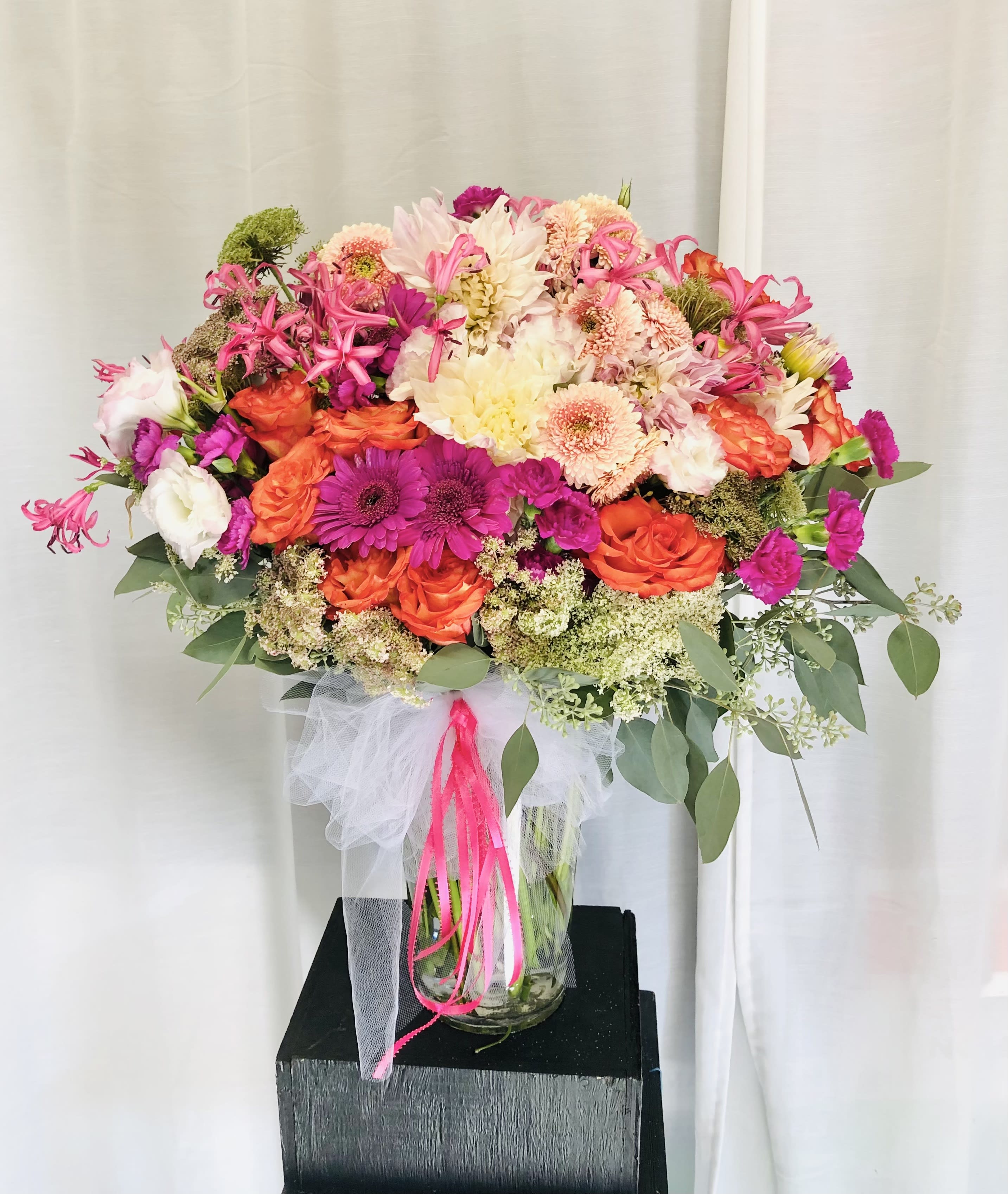 Pink Pallet - Beautiful pink and white vase arrangement featuring daiess, roses, dahlia(seasonal), filler and green leaf accents.