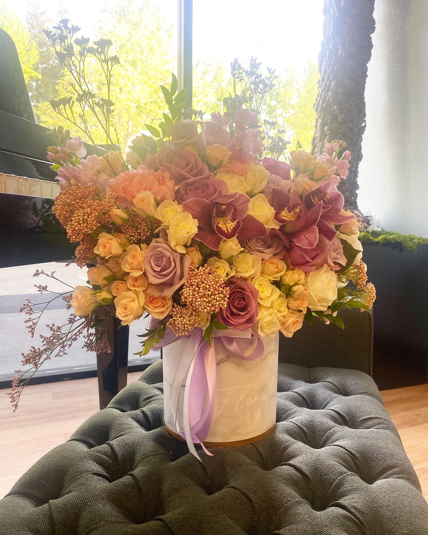 Pop of Orchid Pop of Orchid - Lavender mixed boxed arrangement.