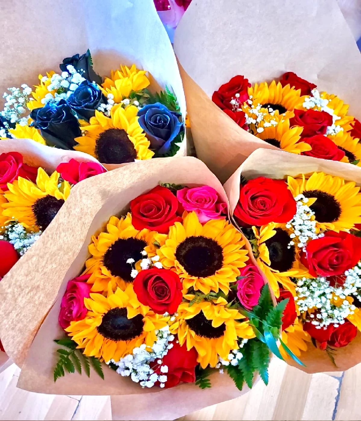 EVE 6 - 6 ROSES AND 4 SUNFLOWERS WRAPPED IN PAPER   Return &amp; Exchange Policy At Blooming Ideas, our customers receive a four day guarantee which covers our floral arrangements and bouquets that die within 96 hours. With this guarantee, you will be able to receive a refund or a free arrangement.