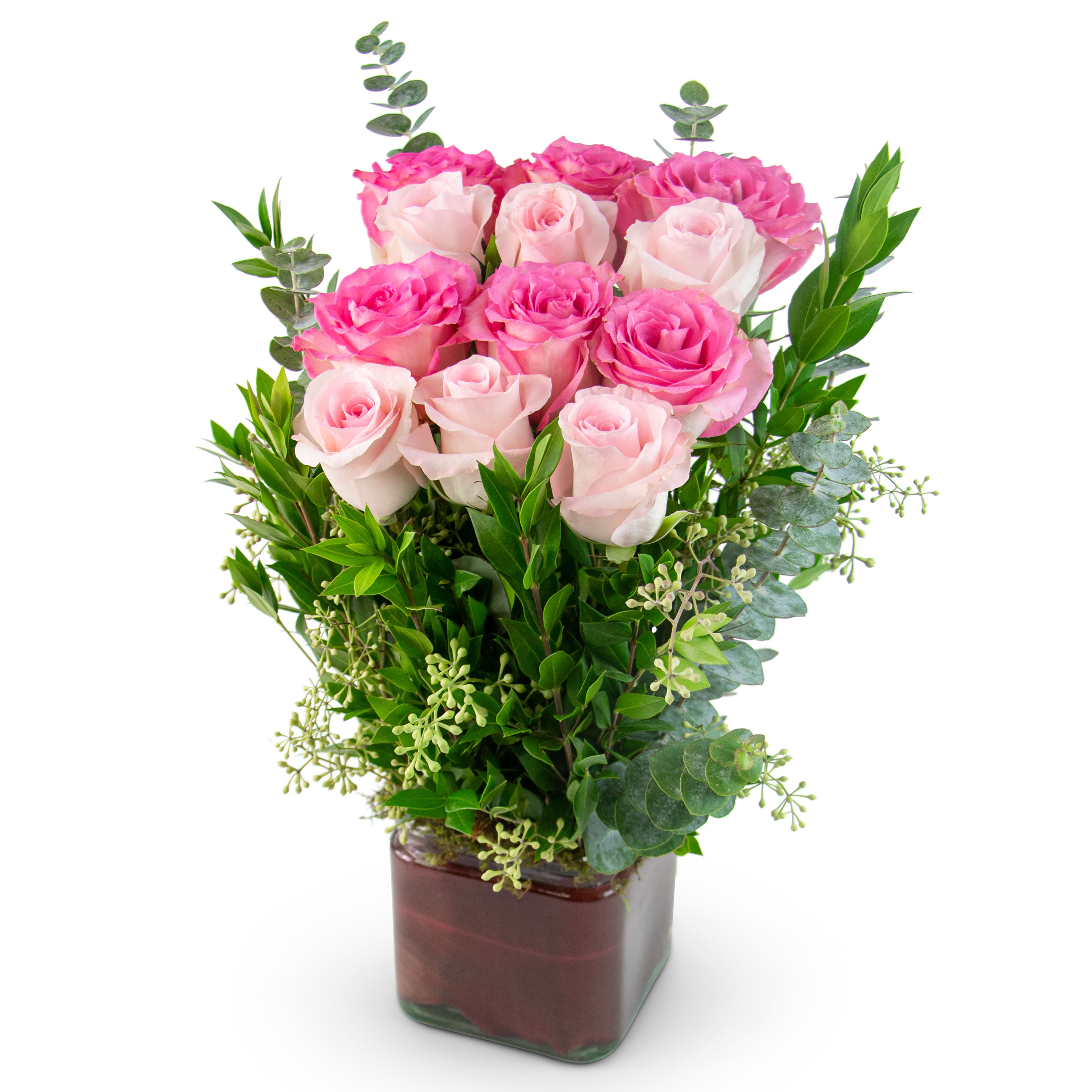 Rosé All Day - TMF-1023 - What romantic love in your life doesn’t deserve a precious bouquet gift of Rosé All Day?! With a dozen pink roses, red ti leaf, eucalyptus, seeded eucalyptus, and myrtle, Rosé All Day was created to be sent to your unique love for Valentine’s Day, their anniversary, or just because you are feeling all the feels of love and romance and have the desire to gift your giver of love with beautiful flowers. Approximately 7&quot; wide by 12&quot; high