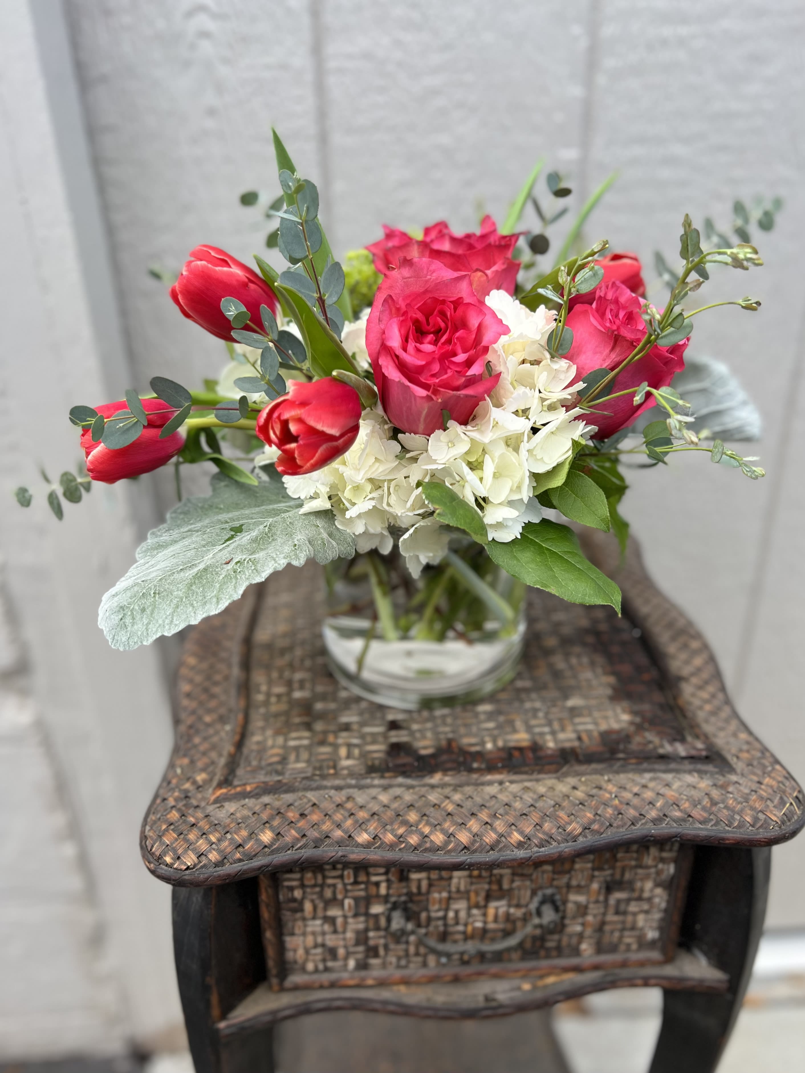 French Kiss  - A lovely arrangement containing a combination of hydrangea, roses, tulips and greenery. 