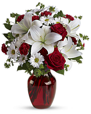 Be My Love Bouquet with Red Roses - Add some romance to the holiday season with this rich arrangement of luxurious flowers in classic winter colors. Red roses, snow white lilies and playful daisies are gathered in a ruby red vase. Red roses, white asiatic lilies, white daisy spray chrysanthemums, mini red carnations and sprigs of bupleurum and salal are presented in a graceful red glass vase.