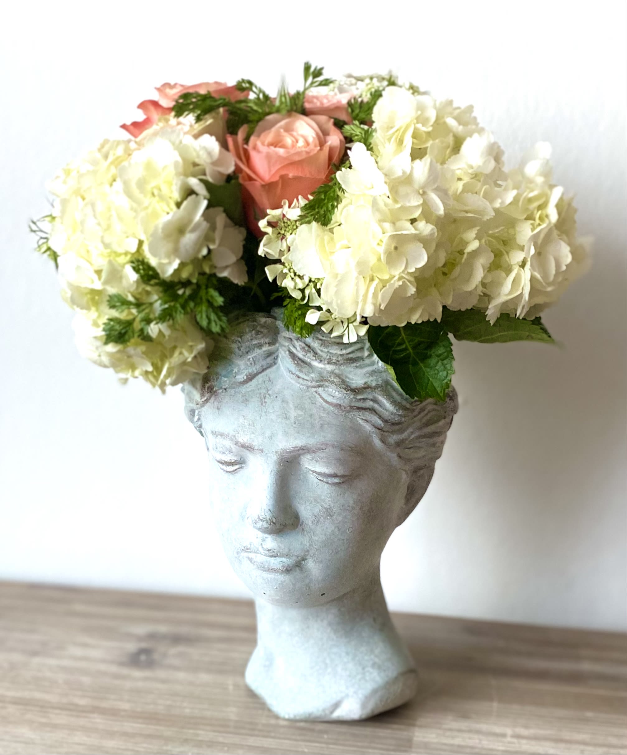 Flowers in sculptural vase by Shoots and Blooms of D.C.