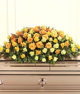 Bountiful Casket Spray - This bountiful casket spray is a beautiful way to express what words simply cannot. A gorgeous montage of orange, yellow and green roses are delicately arranged by our expert floral artisans.  This spray is traditionally delivered right to the funeral home. Includes: • Orange Roses  • Yellow Roses  • Green Roses  * Our florists select the freshest flowers available. If the flower or floral container shown online is not available, a similar flower or container will be used.