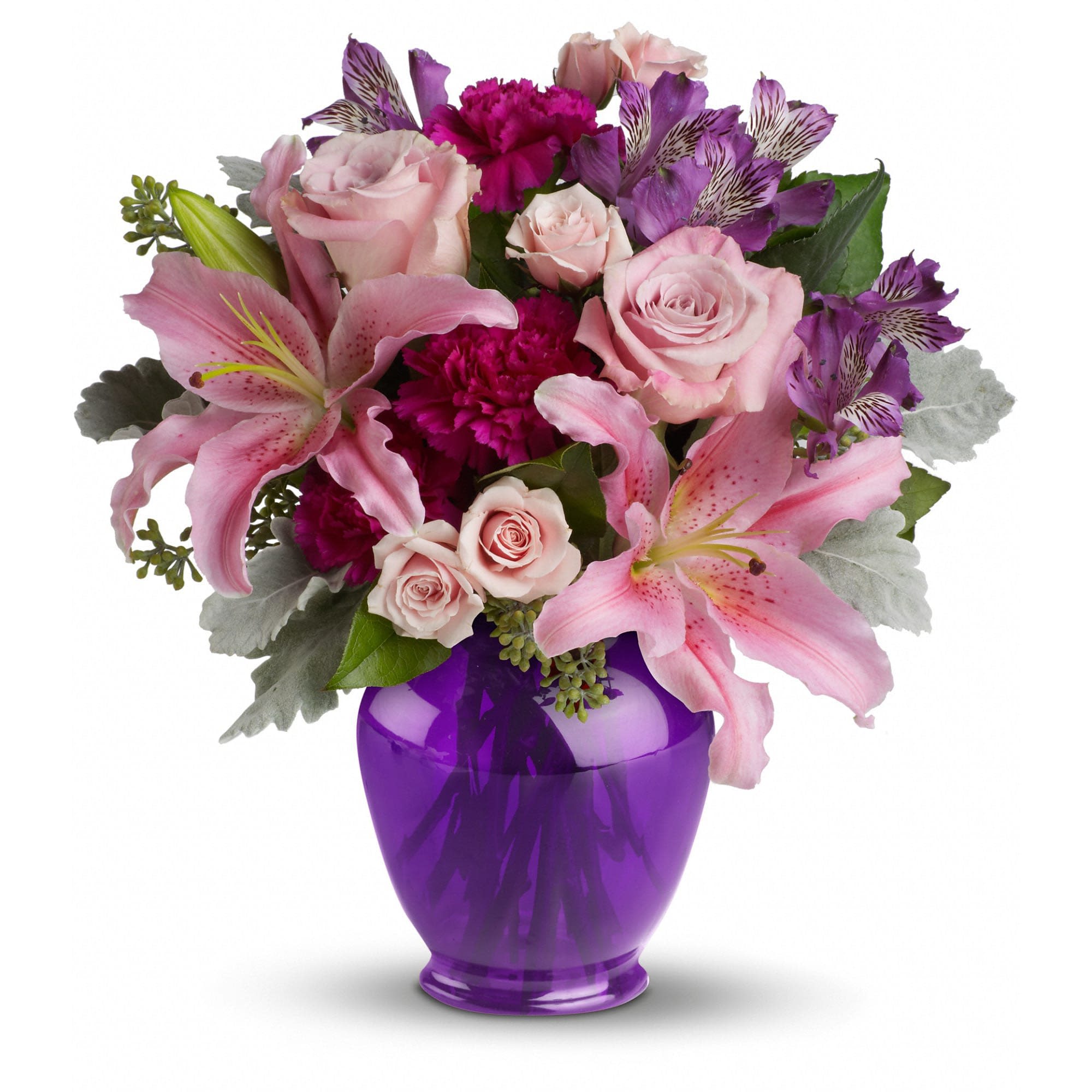 Teleflora's Elegant Beauty - Take their breath away with a spectacular array of pink roses and lilies in a classic ginger jar in deep royal purple. Truly a stunning gift, but without a stunning price tag.  
