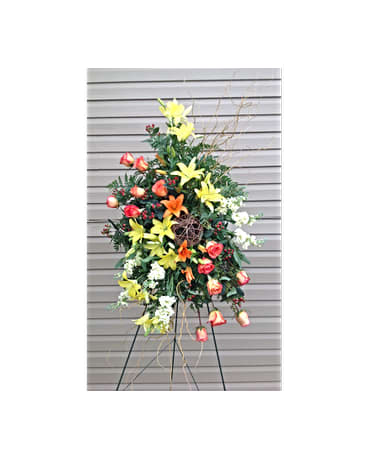 Warm Embrace Spray Warm Embrace Spray - This hand arranged spray includes yellow and orange Lilies orange/Circus Roses Stock Hypericum Berries and curly willow. All flowers and colors are subject to change due to availability. FCF-0308