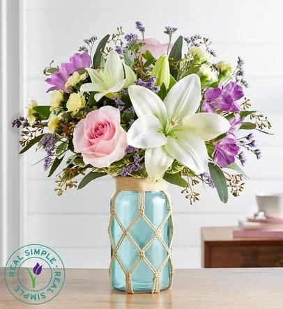 Pastel Petals™ by Real Simple® - This arrangement has light pink roses, white lilies, and lavender alstroemeria making a beautiful piece.