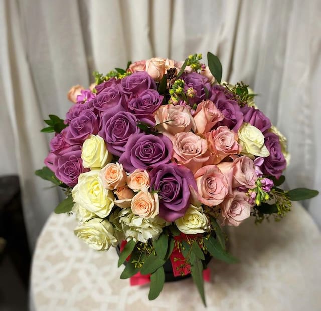 Flower box - A luxurious display of roses and accent flowers in a large hat box. Perfect for Mothers day or any special occasion. 