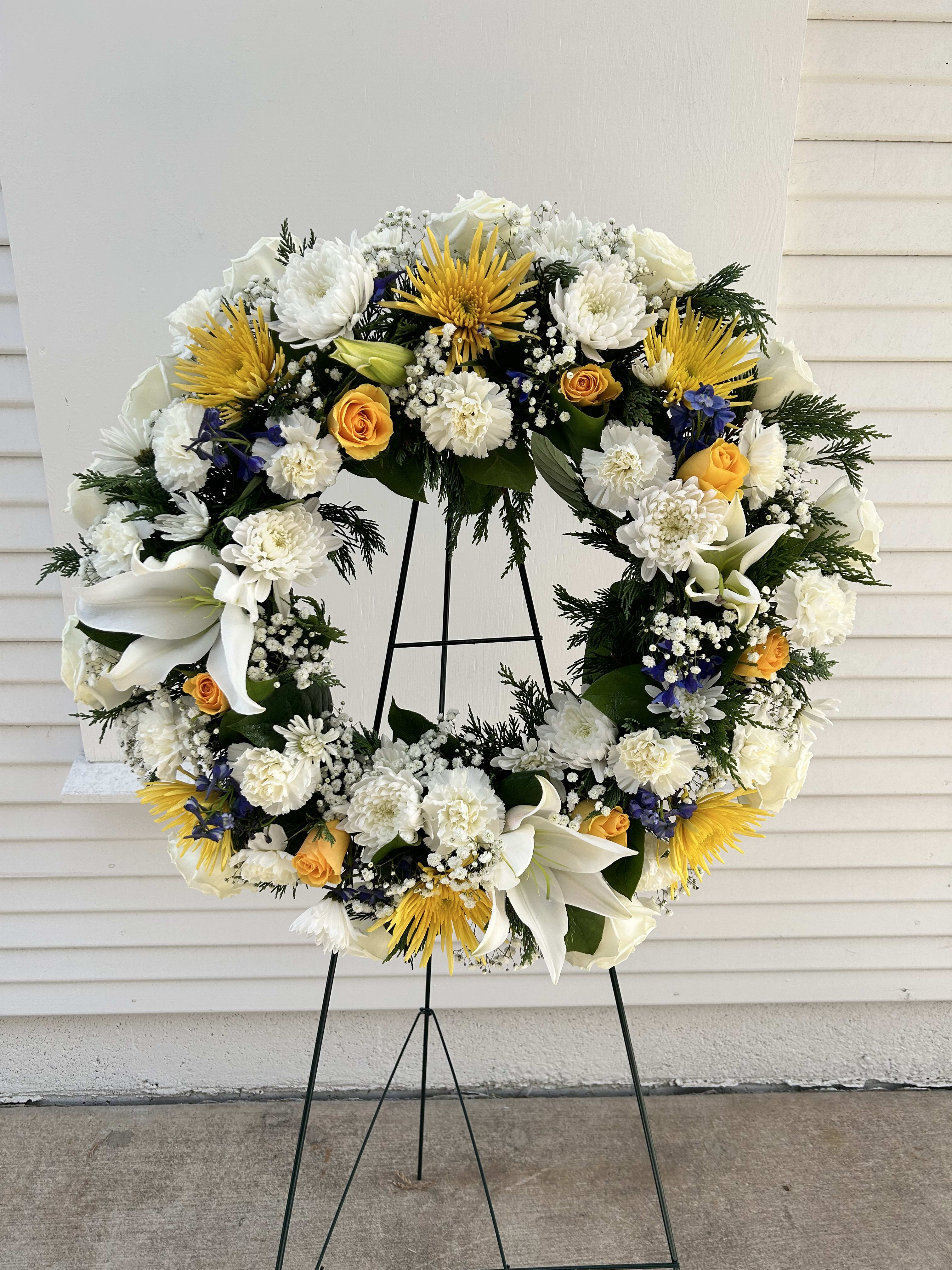 Love Love - This wreath spray is 24" in width and the colors can be changed, as long as you place the order a week in advance.
