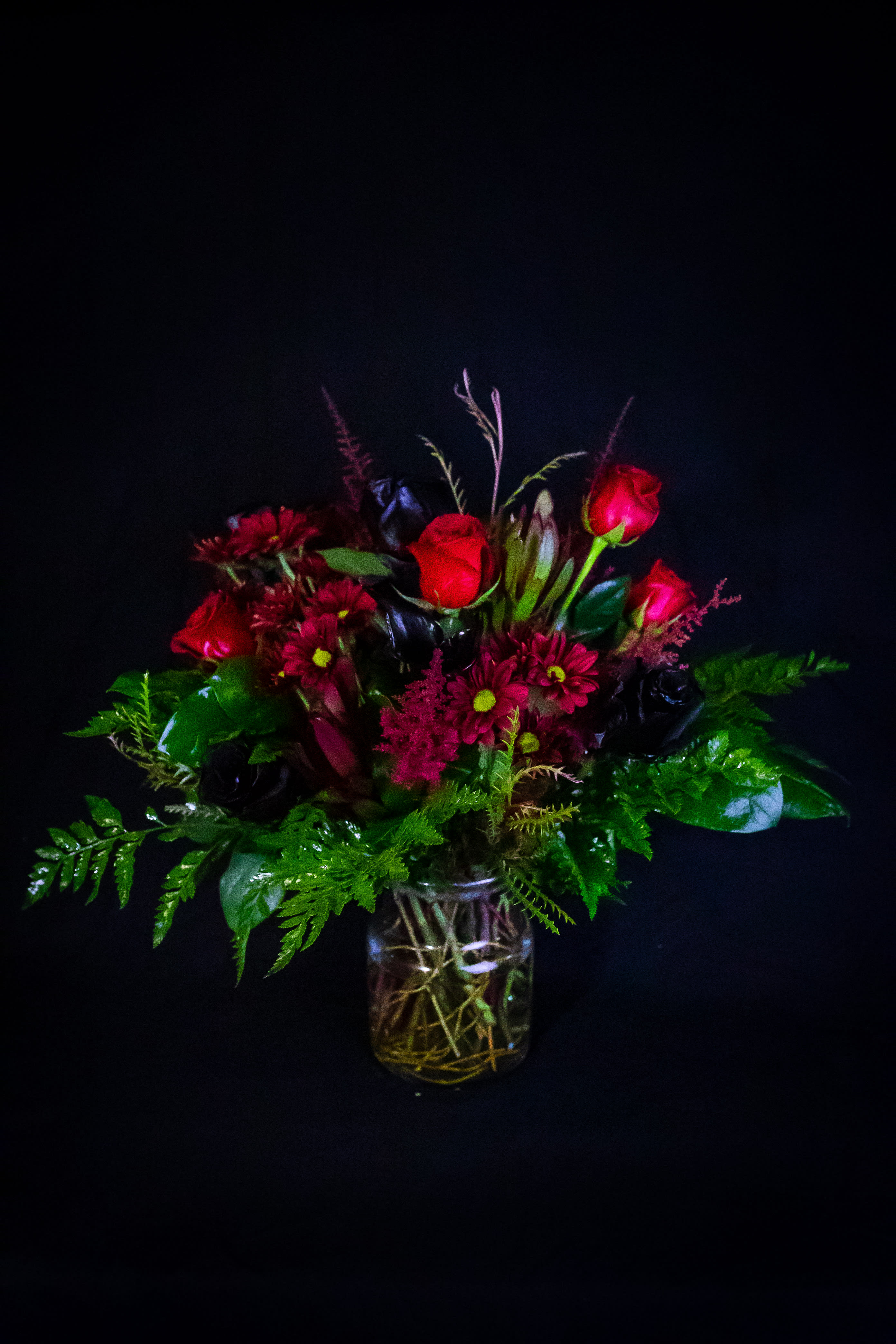 Natalie Natalie - Red roses, Red daisies, Black calla lilies, Safari sunset, Black roses, Purple goldenrod