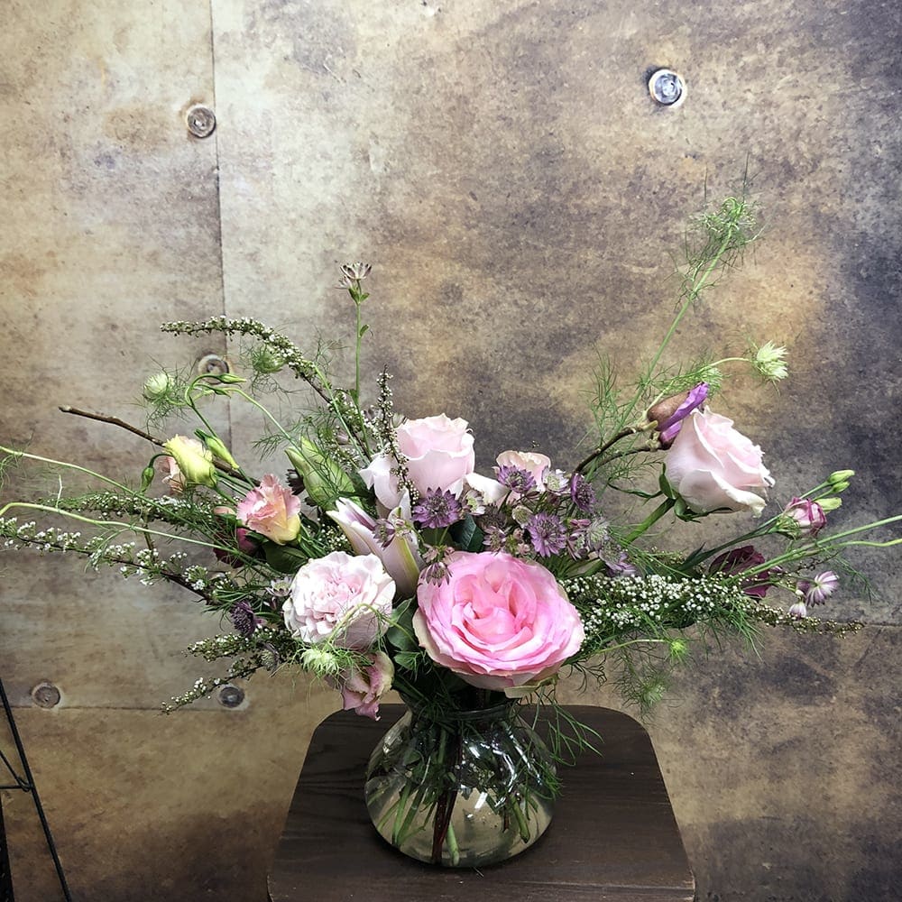 Pinkilicous - Say &quot;hello&quot; with a sweet arrangement of in-season pink blossoms in poise vase.  