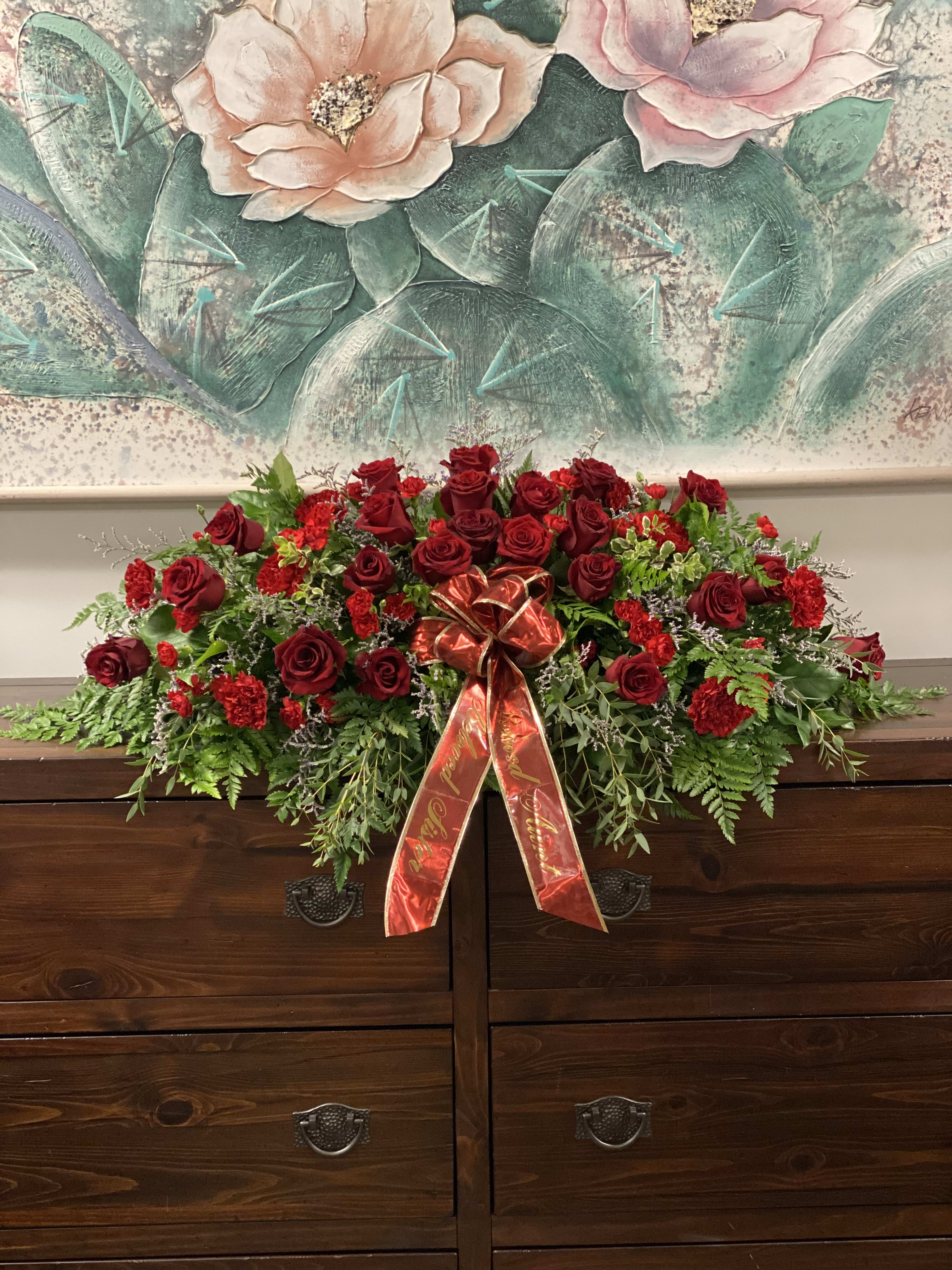 Love and Appreciation Casket Spray Love and Appreciation Casket Spray - This casket spray of red roses and carnations speaks loudly of love and appreciation.