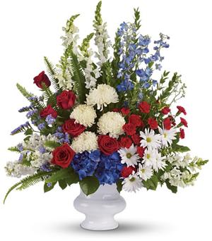 With Distinction - A dazzling display of patriotic red, white and blue flowers sends a silent yet poignant statement about hope, freedom and the strength to endure. This proud bouquet is a testament to life that is sure to be appreciated.