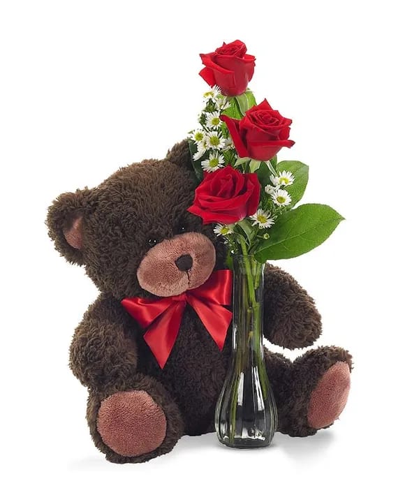 Teddy Bear and Bud Vase Arrangement - Send a cute and cuddly gift with the Classic Bud Vase Roses with Bear. Created by a local florist partner with three long-stemmed roses, which are paired with white monte casino in a cute vase. The red roses, which are perfect to send to a loved one who is dear to you are paired with the cutest plush teddy bear. The Classic Bud Vase Roses with Bear is a great gift to send to your daughter at school or to your loved one at home. Available for same day delivery.   Includes: • Red Roses  • Plush Teddy Bear  • Glass Bud Vase