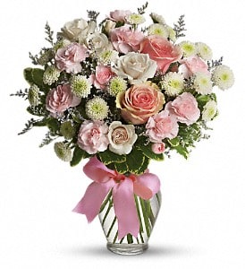 Cotton Candy T37-1 STANDARD DELUXE AND PREMIUM - Pretty pink roses, spray roses and miniature carnations, white button spray chrysanthemums, lavender limonium and green pittosporum fill a spring glass vase that's wrapped with a pink satin ribbon. It's confection perfection! Approximately 13&quot; W x 14 1/2&quot; H  T37-1A