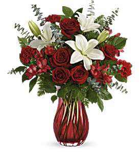 Love Conquers - This lovely ombre vase sets the exquisite tone of the bouquet