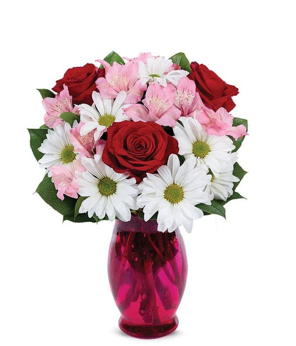 Honey Bunch - A delightful surprise for your &quot;honey bunch&quot; containing roses, alstroemeria, and daisies with a touch of greenery.  (May be in a clear vase depending upon availability.)