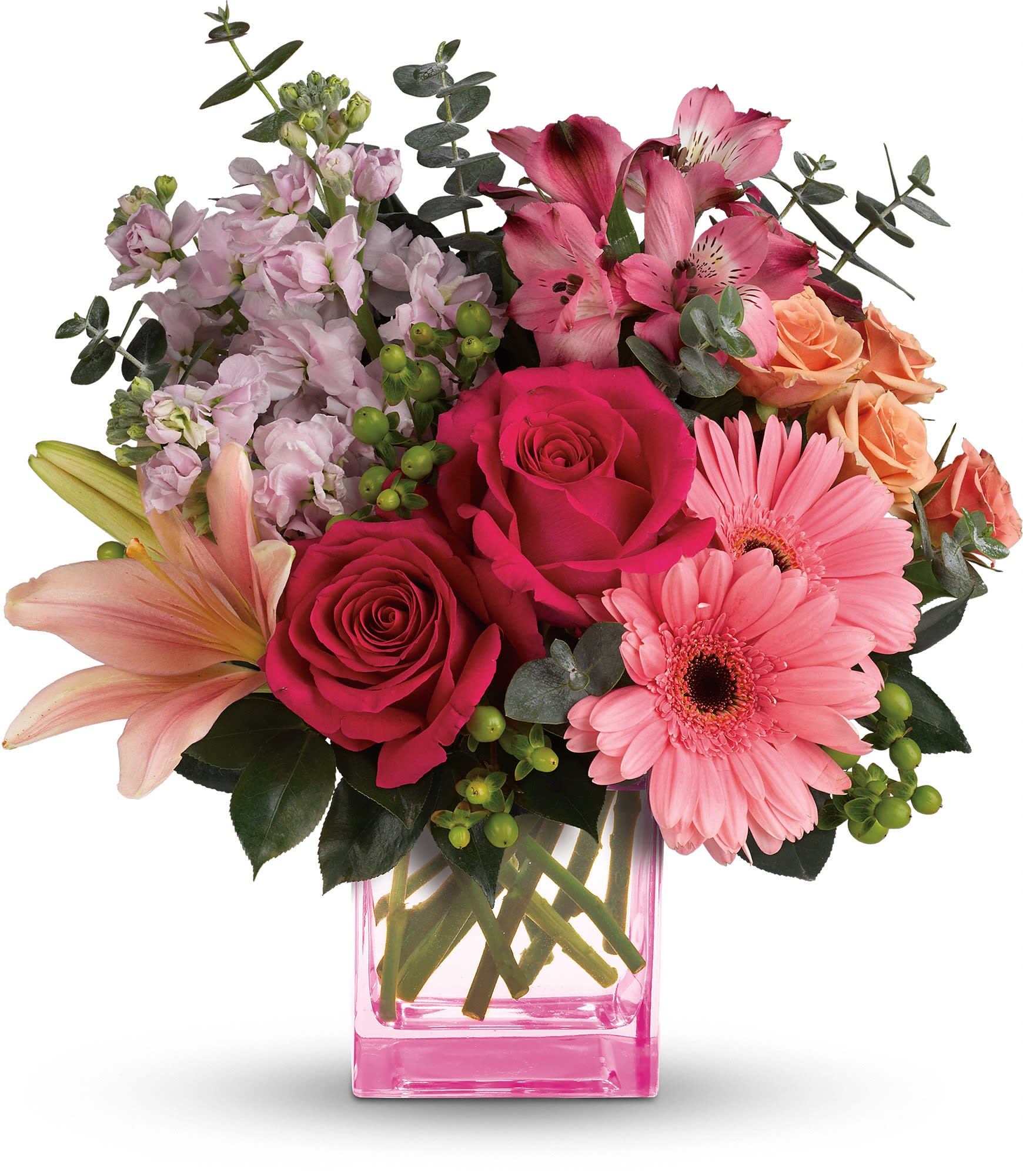 Painterly Pink Bouquet - Pretty as a painter's palette! Warm, wondrous shades of pink and peach play perfectly in this feminine bouquet that's artfully arranged in a pretty pink cube vase. What a fun, fabulous way to celebrate any occasion! his colorful arrangement includes hot pink roses, peach spray roses, pink asiatic lilies, pink gerberas, dark pink alstroemeria, pink stock, green hypericum, spiral eucalyptus and camellia leaves. Delivered in a pink cube vase. Approximately 13&quot; W x 13 1/2&quot; H