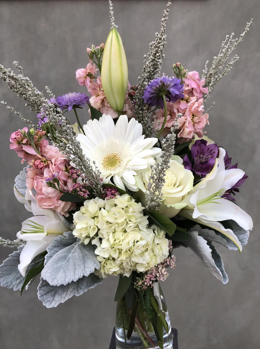 Peaceful Dream Peaceful Dream - Lilies, Gerbera Daisy, Stocks, Hydrangeas, etc. All hand arranged in a glass vase.