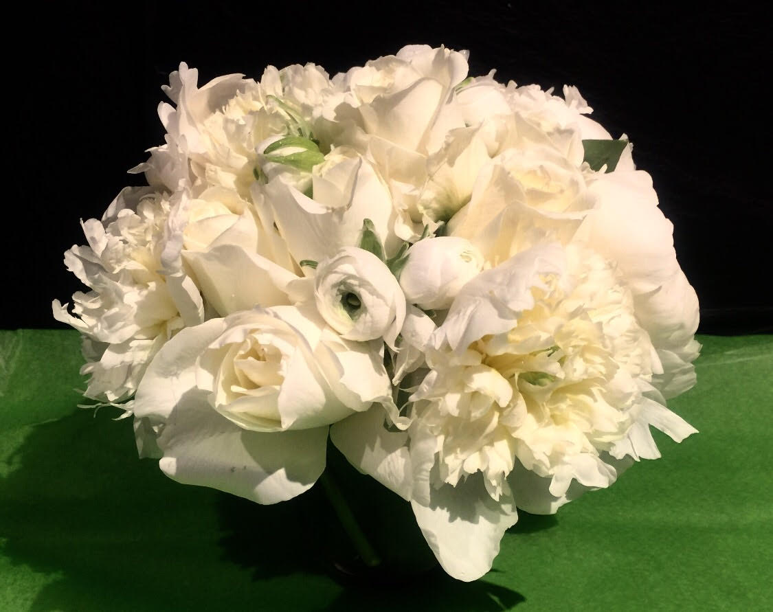 Monochromatic Becomes You - Dazzling arrangement of white flowers.