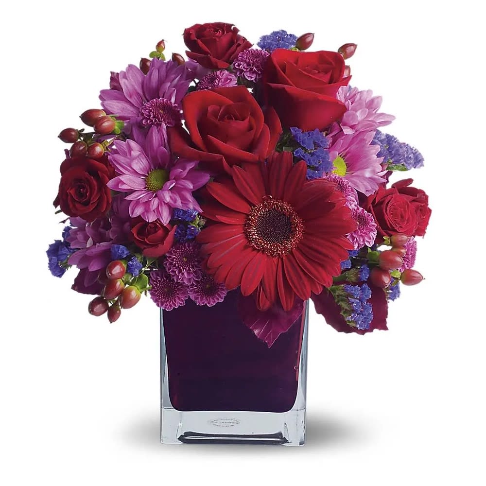It's My Party - The only crying that this plum party arrangement might inspire are tears of joy! So fabulous. So fun. So fall with its jewel-toned modern cube that's chock full of gorgeous red, purple and perfect flowers. Red roses and gerberas, dark red spray roses, lavender chrysanthemums, purple statice and red hypericum are beautifully arranged in a plum cube vase. So get the party started!