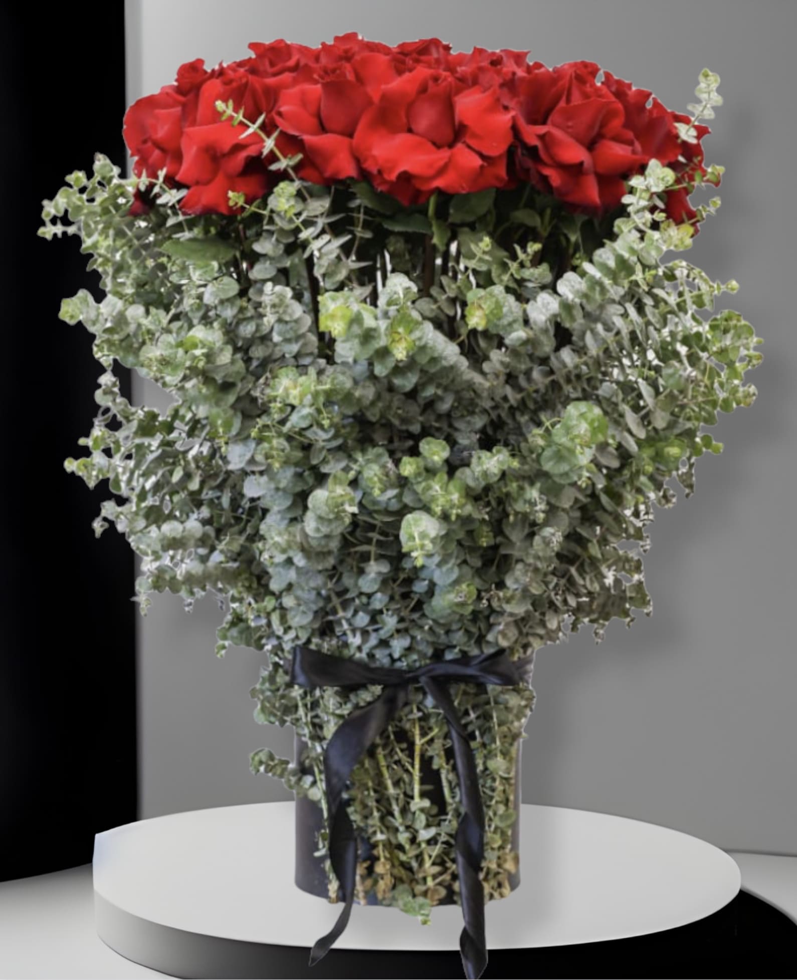 Romance  - This arrangement comes in a sway box with beautiful fresh red roses and surrounding greenery. 
