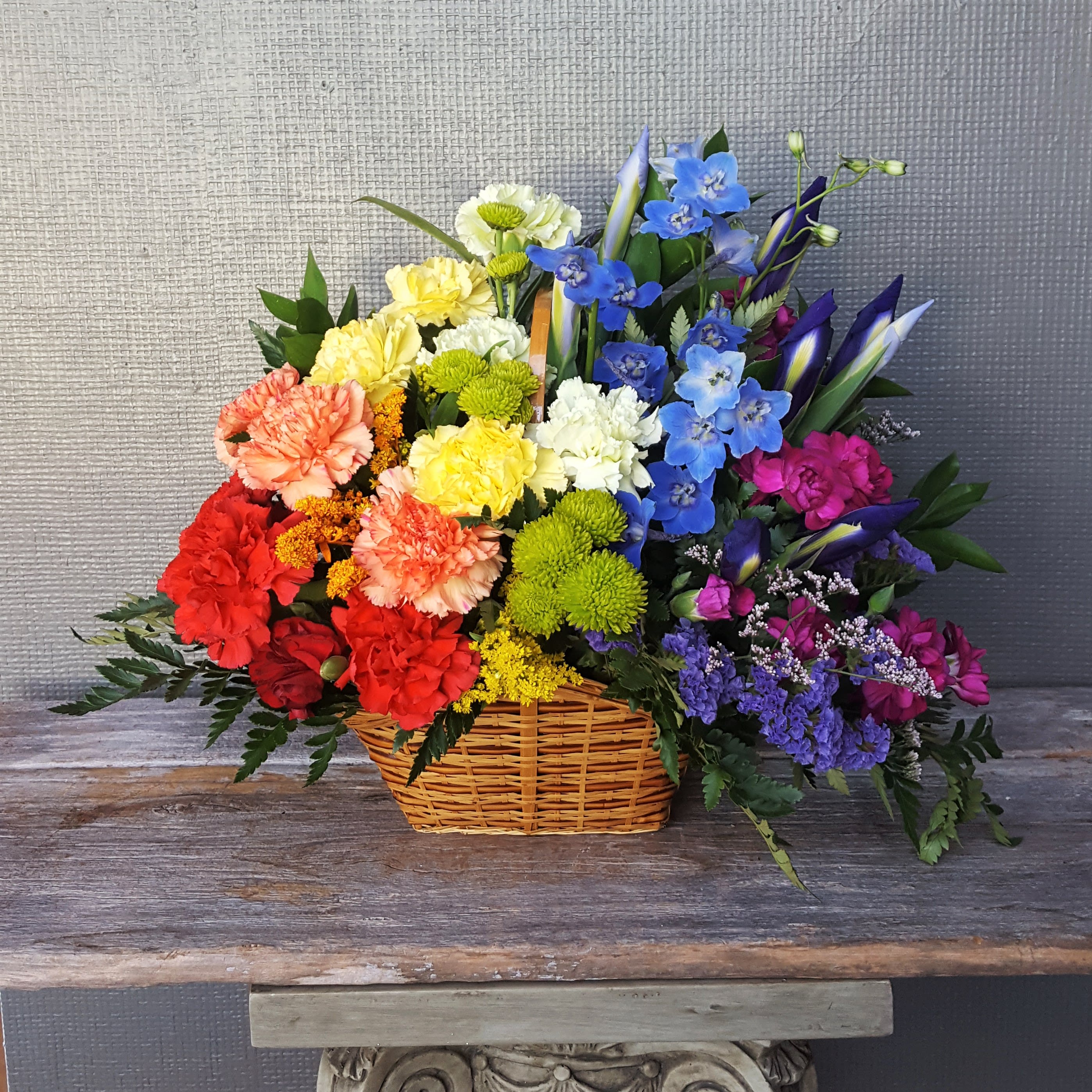 Simply Love - Celebrate the rainbow and everything it stands for. A prismatic array of our freshest flowers in a charming basket. Beautiful for any occasion.