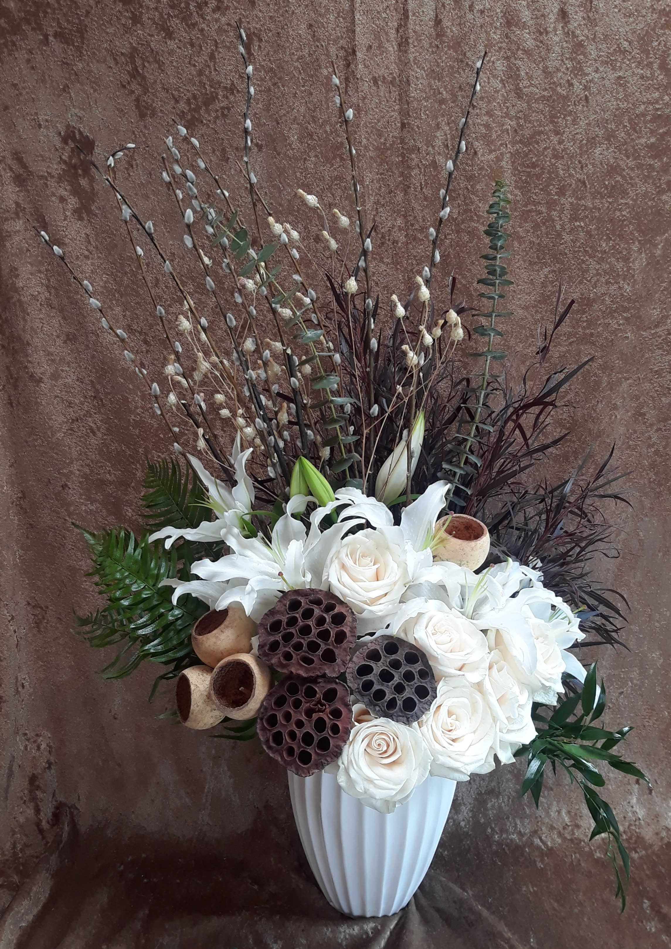 Ivory style - Shown: REGULAR 30H 18W A mix of white lilies and roses accented with dried elements for a sophisticated appeal. 