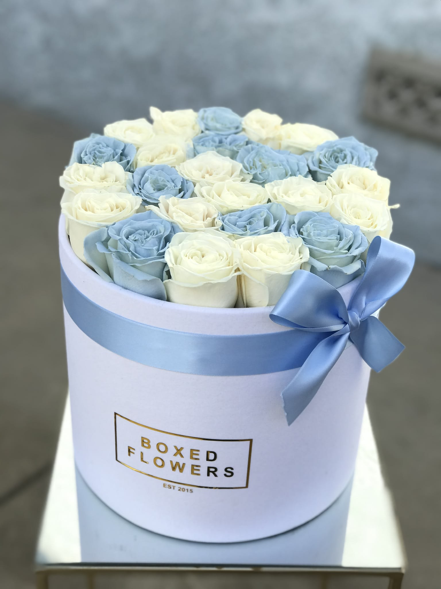 25 rose white and blue rose box by Boxed Flowers and Sweets