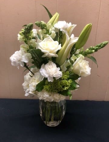 Peaceful Bouquet  - An all white, elegant bouquet of fresh blooms. Delivered in a clear glass vase. A Simple and classy statement , for many different occasions.